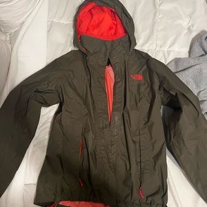 Green and peach north face windbreaker